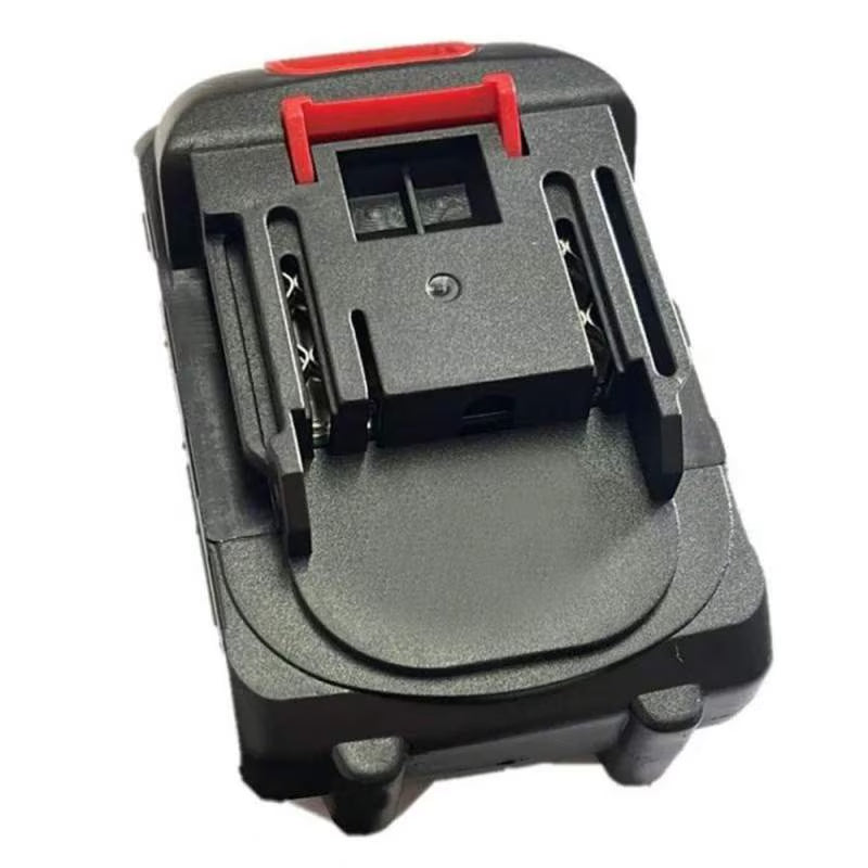 Acumulator negru cu buton roșu, două contacte și prindere pe șină, vedere de sus.